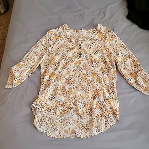 Matrices medium sized white blouse with yellow, blue, and pink flowers